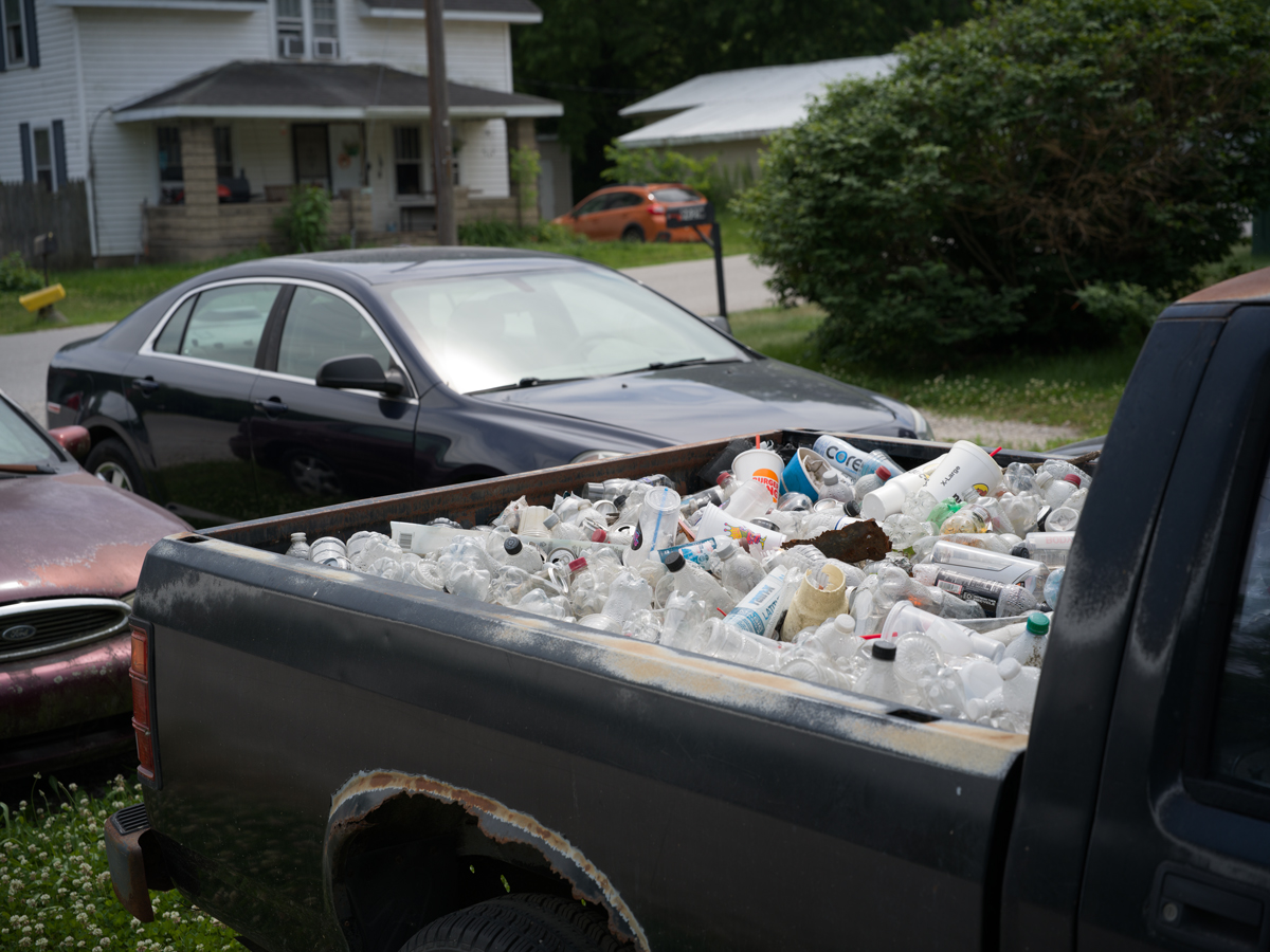 Truck bed filled with discarded water bottles, Pittsburg Flowing Well, Pittsburg, IN